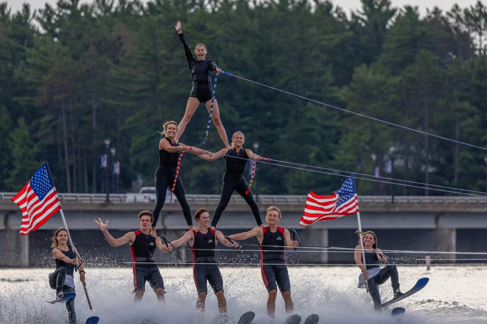 Water-skiers forming a pyramid on the lake